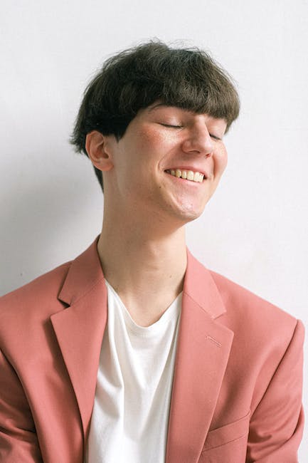 Man in Pink Suit Jacket Smiling